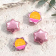 Pink foil star chocolates with “Happy Mother’s Day” label, arranged in set.