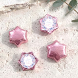 Foil-covered chocolate stars set in pink and rose pink, with one personalized butterfly-style star.