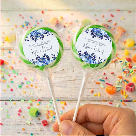 Personalised lollipop pair with navy floral labels, 'Kyle & Richard', green wrap