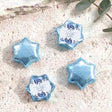 Baptism foil chocolate stars: blue floral thank-you label on light blue star
