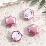 Foil-covered chocolate stars in pink with a First Holy Communion-style label