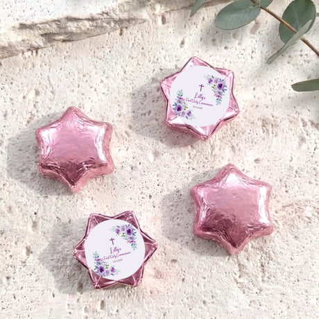 Pink foil chocolate stars with floral cross Communion label on a round centre card