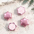 Pink foil star chocolates with Luna's First Birthday label