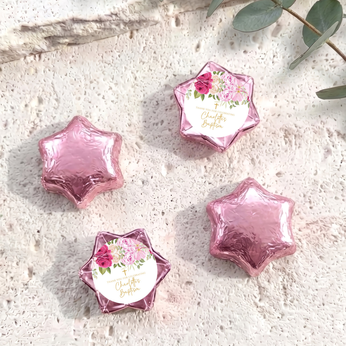 Foil-covered chocolate stars with floral personalized label, pink foil shapes