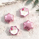 Foil-covered chocolate stars with floral personalized label, pink foil shapes
