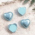 Pastel blue heart foil chocolates with cross and personalised label