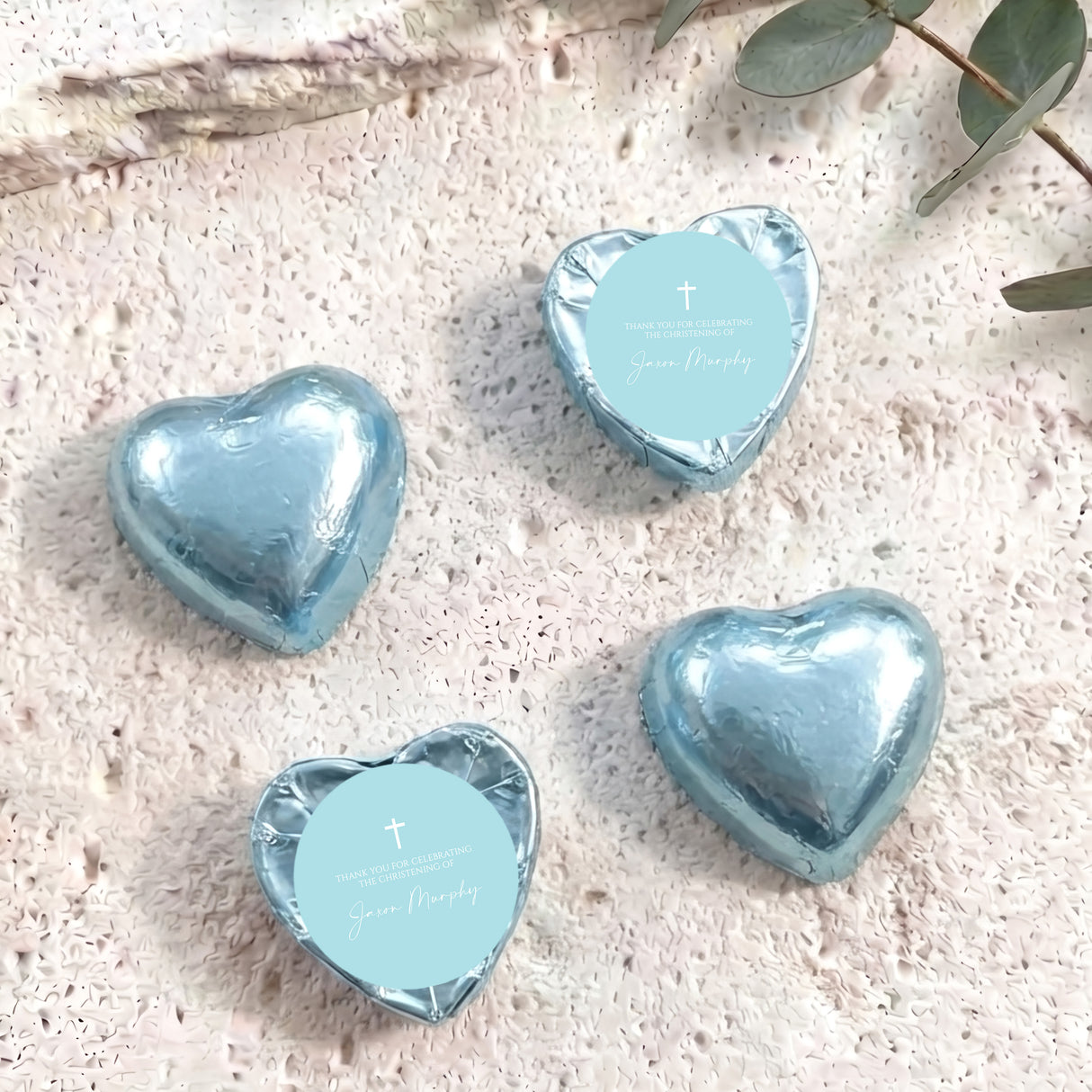 Pastel blue heart foil chocolates with cross and personalised label