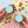 Pastel blue christening pretzel bag set with white cross seal and personalised text