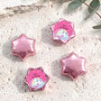 Pink star-shaped foil chocolate with “Zara’s 6th Birthday” unicorn rainbow label