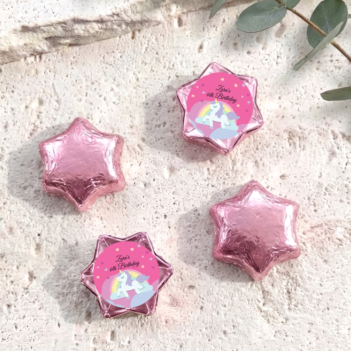 Pink star-shaped foil chocolate with “Zara’s 6th Birthday” unicorn rainbow label