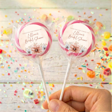 Personalized bridal shower lollipops with pink rim and floral thank-you labels