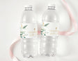 Personalised water bottle labels on two clear plastic drink bottles with eucalyptus and gold cross