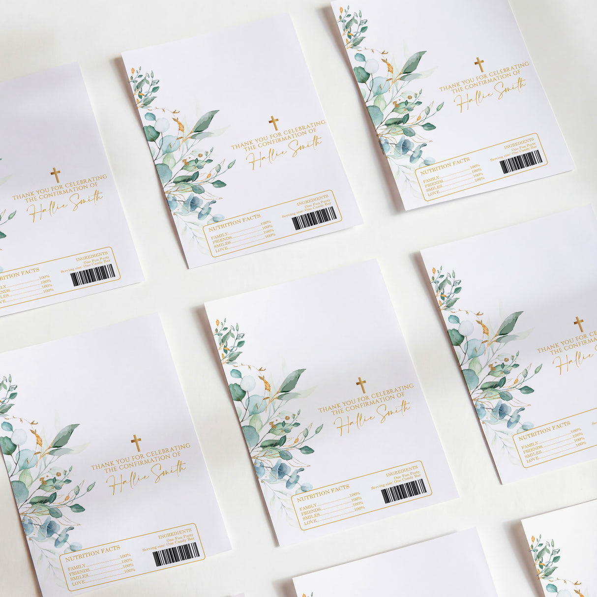 DIY printed chocolate wrappers with eucalyptus leaves, gold cross, and fill-in message lines