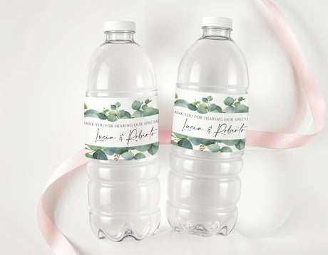 Personalised water bottle labels with eucalyptus leaves, name text, on clear plastic bottles