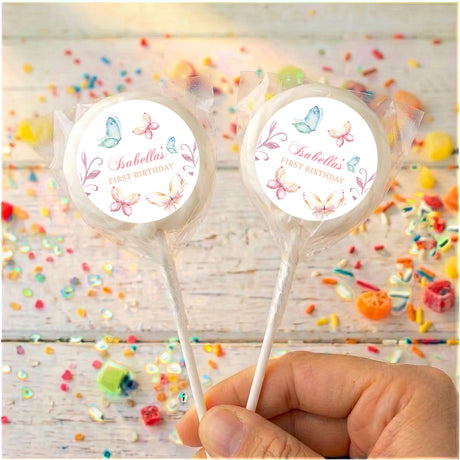 Personalised lollipops: two pastel butterfly round labels on sticks with clear edging.