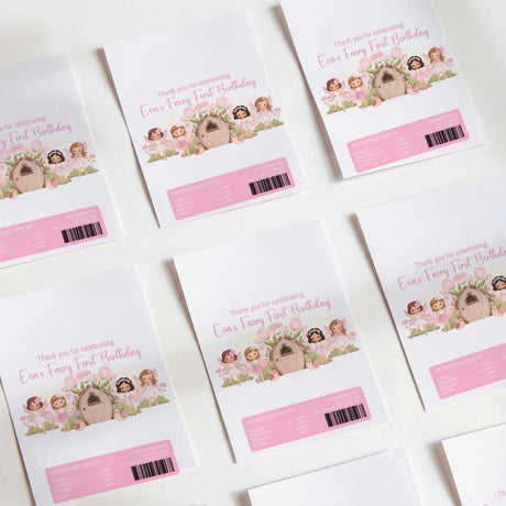 Pink fairy-themed first-birthday printed chocolate wrappers with barcodes and text