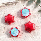 Personalised foil chocolate stars in red with baptism label and cross motif