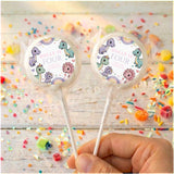 Dinosaur birthday lollipops with “Dolly is Four” round wrapper labels, green accents