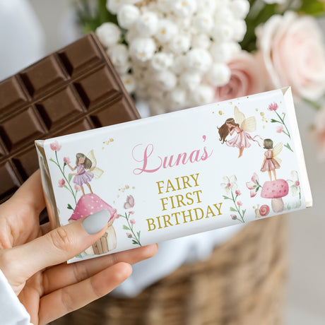 Fairy first birthday chocolate bar wrapper with Lunas name, pastel flowers and fairy artwork