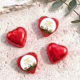 Foil-covered chocolate hearts in red foil with birthday label featuring a construction truck