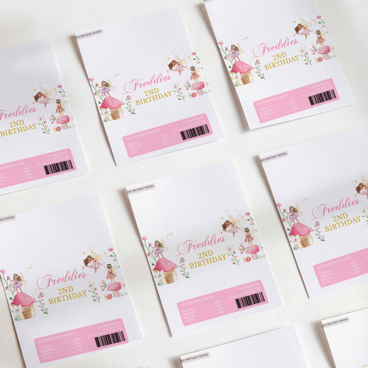 Printed birthday chocolate wrappers, white with fairy illustration and pink barcode label