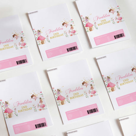 Printed birthday chocolate wrappers, white with fairy illustration and pink barcode label
