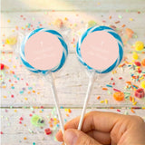 Personalised lollipops with blue spiral wrap and white cross label
