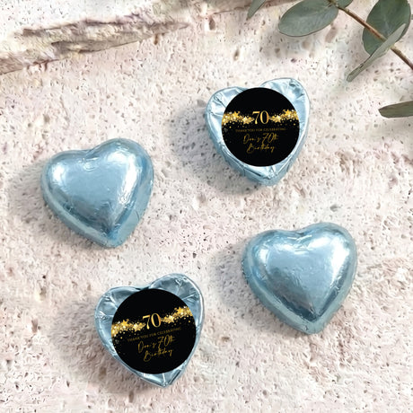 Light blue foil heart chocolates with black label and gold 70 anniversary wording