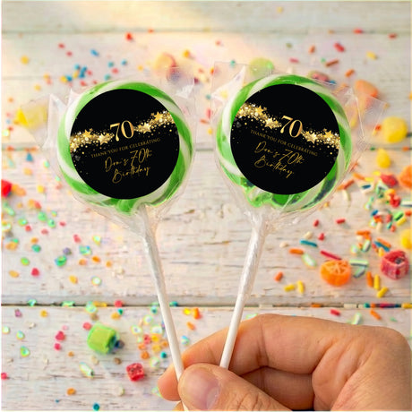 70th birthday personalised lollipops, black gold 70 label with green ring, clear wrap.