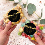 70th birthday popcorn bag with black/gold star sticker: 70 'Thank you for celebrating'.