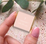 Pastel peach mini chocolate box with white cross, personalised confirmation text