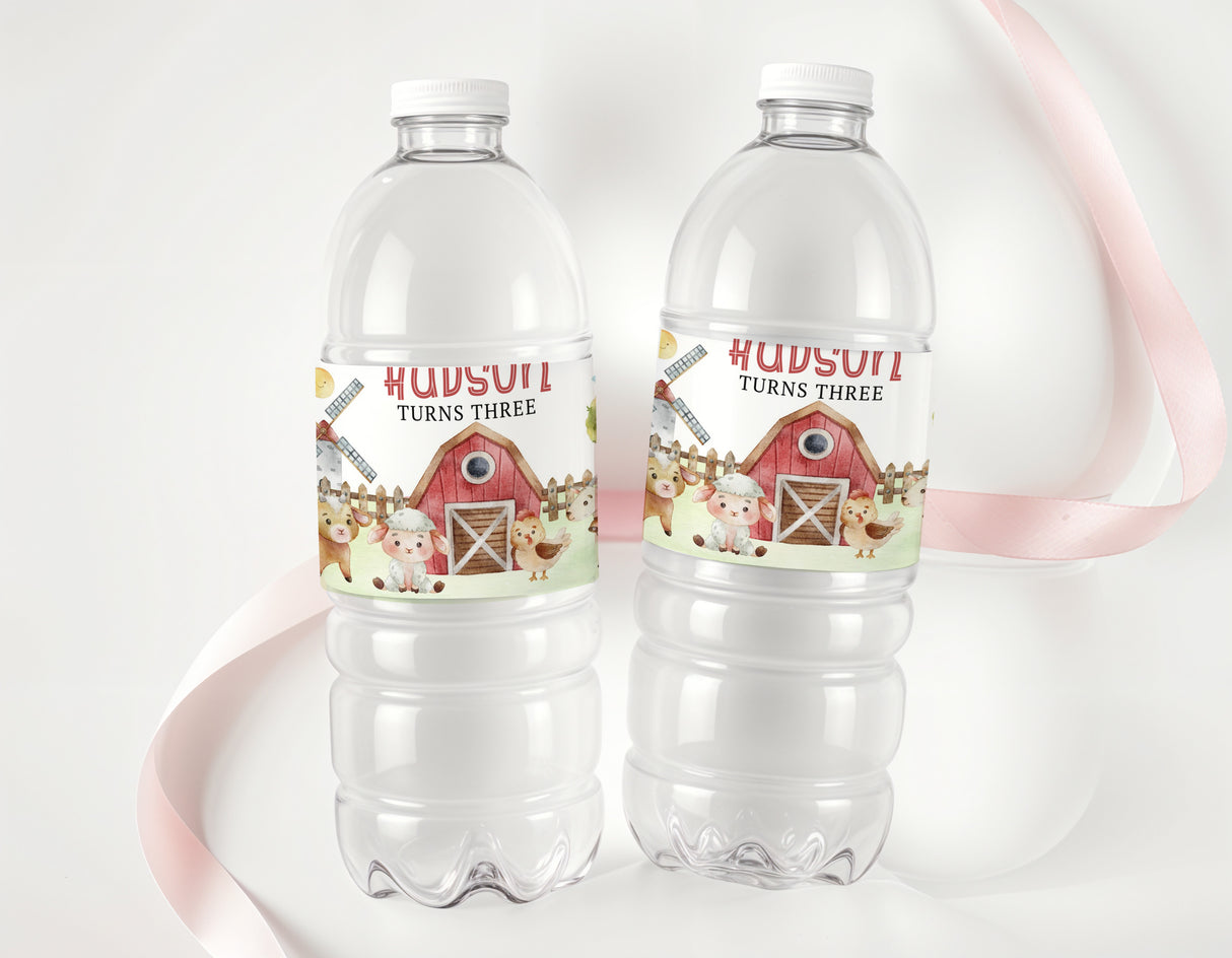 Personalised farm animal water bottle labels on two clear plastic bottles