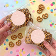 Personalised pretzel gift bag with cross label, clear bag with brown pretzels