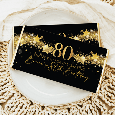 Black 80th birthday chocolate bar with gold stars and 80 text