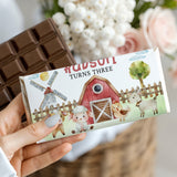 Chocolate bar with white farmyard wrapper, animals and windmill graphic