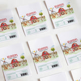 Farm animal printed chocolate wrappers with red barn and Hudson Turns Three text