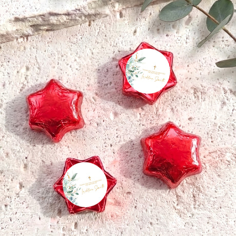 Foil-wrapped chocolate stars in red with gold cross, set of four