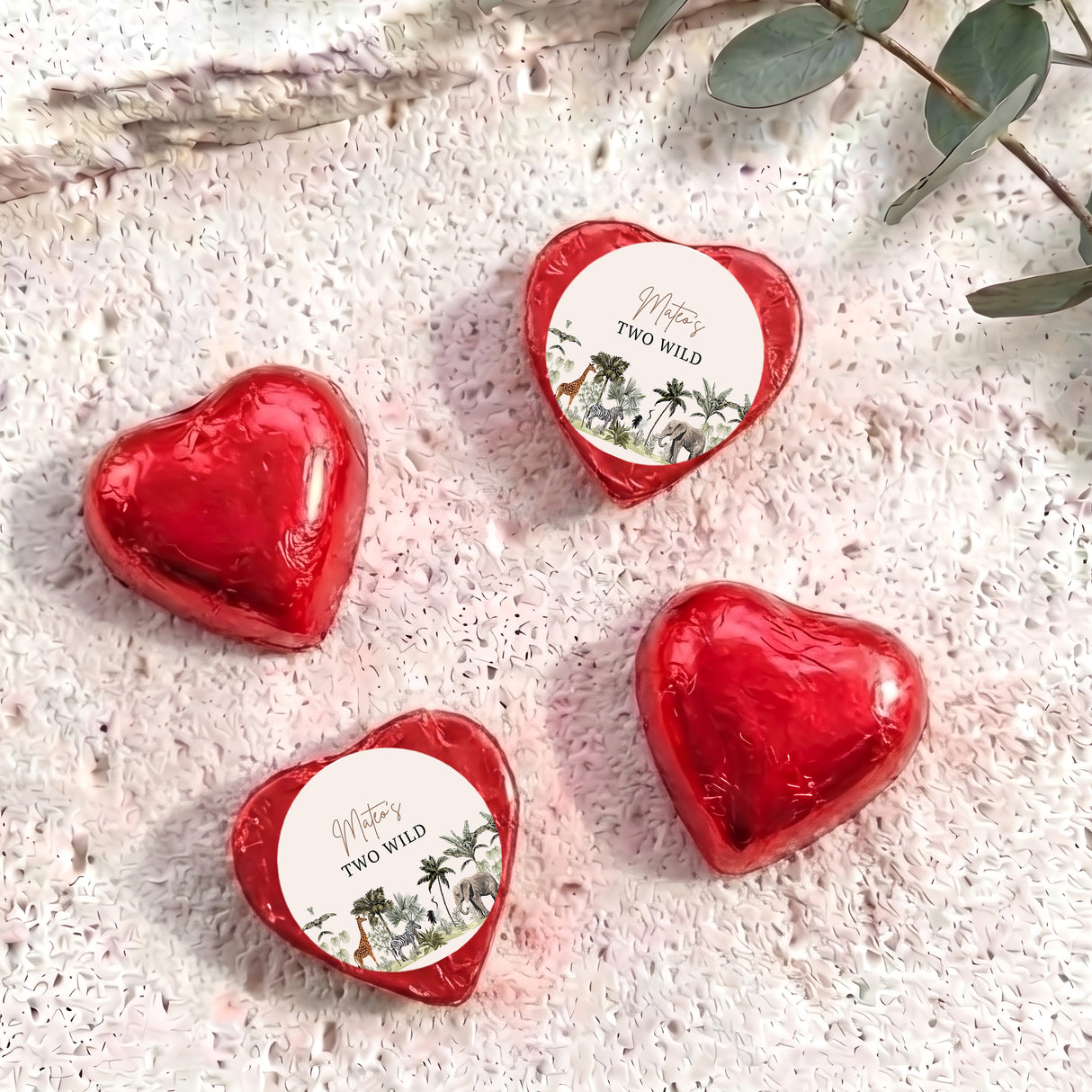 Red foil chocolate hearts with “Two Wild” personalised round label