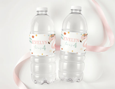 Personalised flamingo water bottle labels on two clear plastic bottles