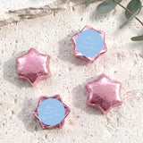 Pink foil-wrapped chocolate stars with round personalized label discs