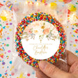 Personalized giant freckles gift bag with multicolor beaded ring and circular baptism label