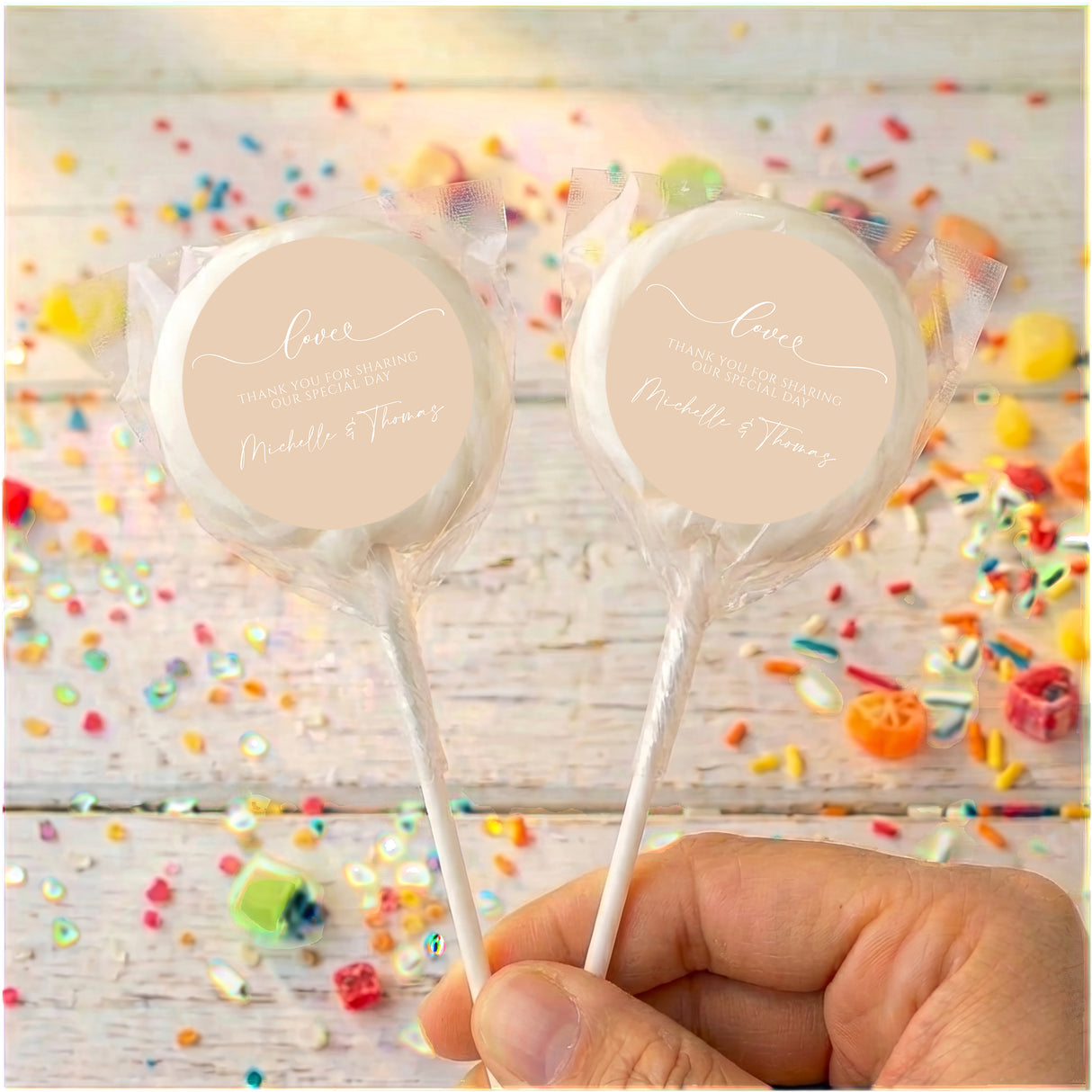 Personalised wedding lollipops with clear wrap and beige thank-you labels