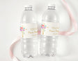 Personalised floral cross water bottle labels on two clear drink bottles
