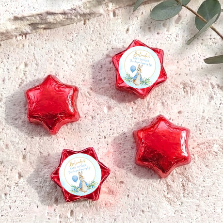 Red foil star chocolates with Peter Rabbit baby shower label, set of 4