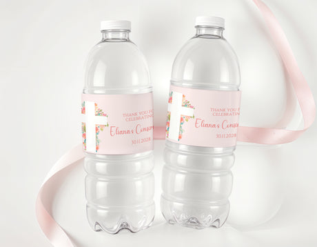Personalised water bottle labels on clear plastic bottles with pink floral accents
