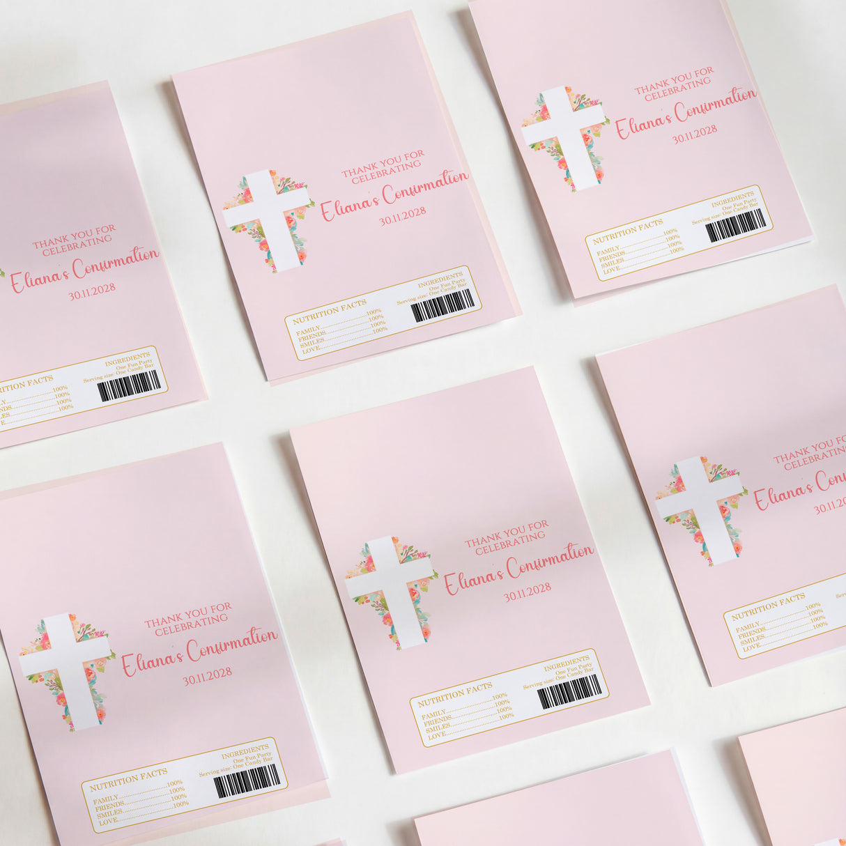 Pink DIY chocolate wrappers with floral cross and thank-you text, barcodes on back