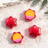Red foil star chocolates with “Happy Mother’s Day” label, arranged in set.