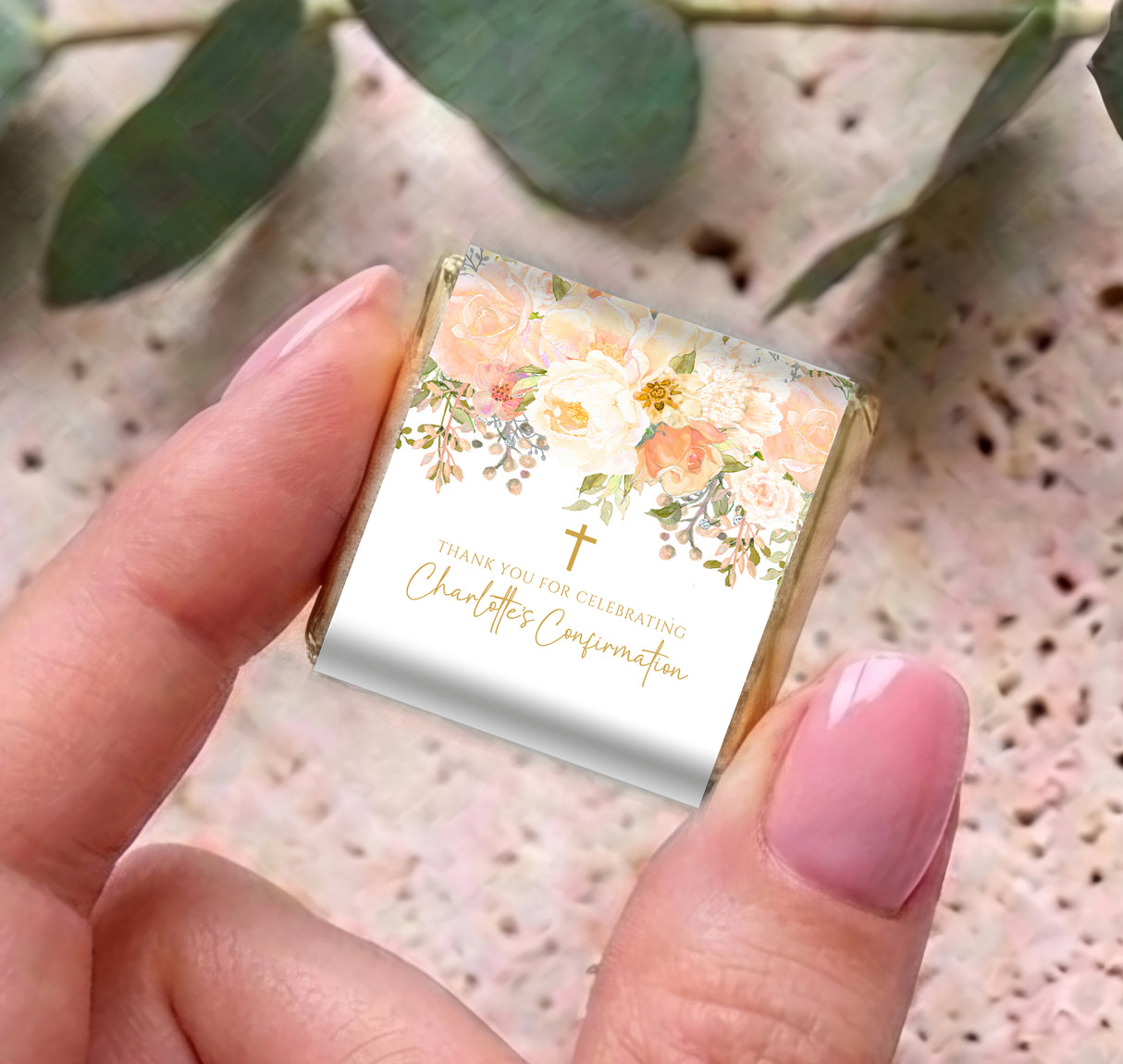 Floral confirmation mini chocolate box with gold cross; pastel peach design in hand