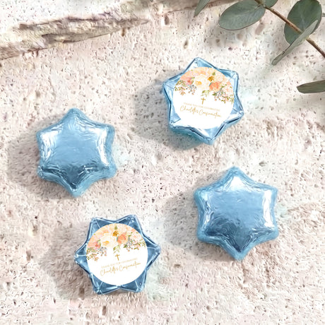 Foil-covered star chocolates with blue foil and a white floral name label