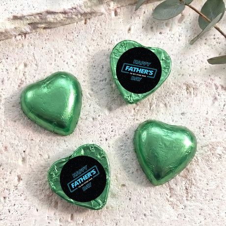 Foil-covered chocolate hearts, green, with “Happy Father’s Day” label on top.